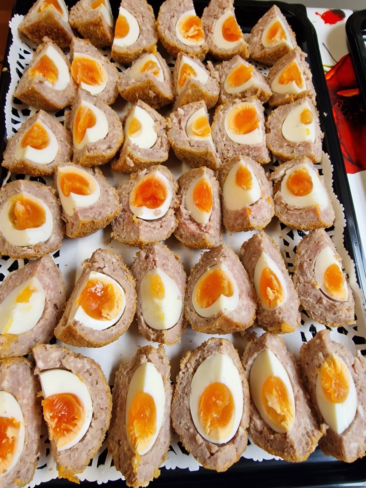 A tray of scotch eggs cut in half